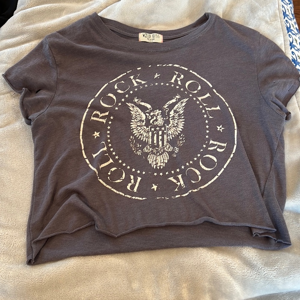 rock and roll tee shirt with a hole